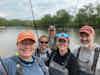 a group of people fishing in the water