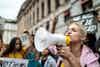 a woman holding a megaphone