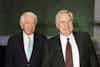 two men in suits smiling