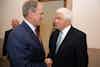 two men in suits shaking hands