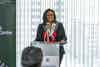 a woman standing at a podium
